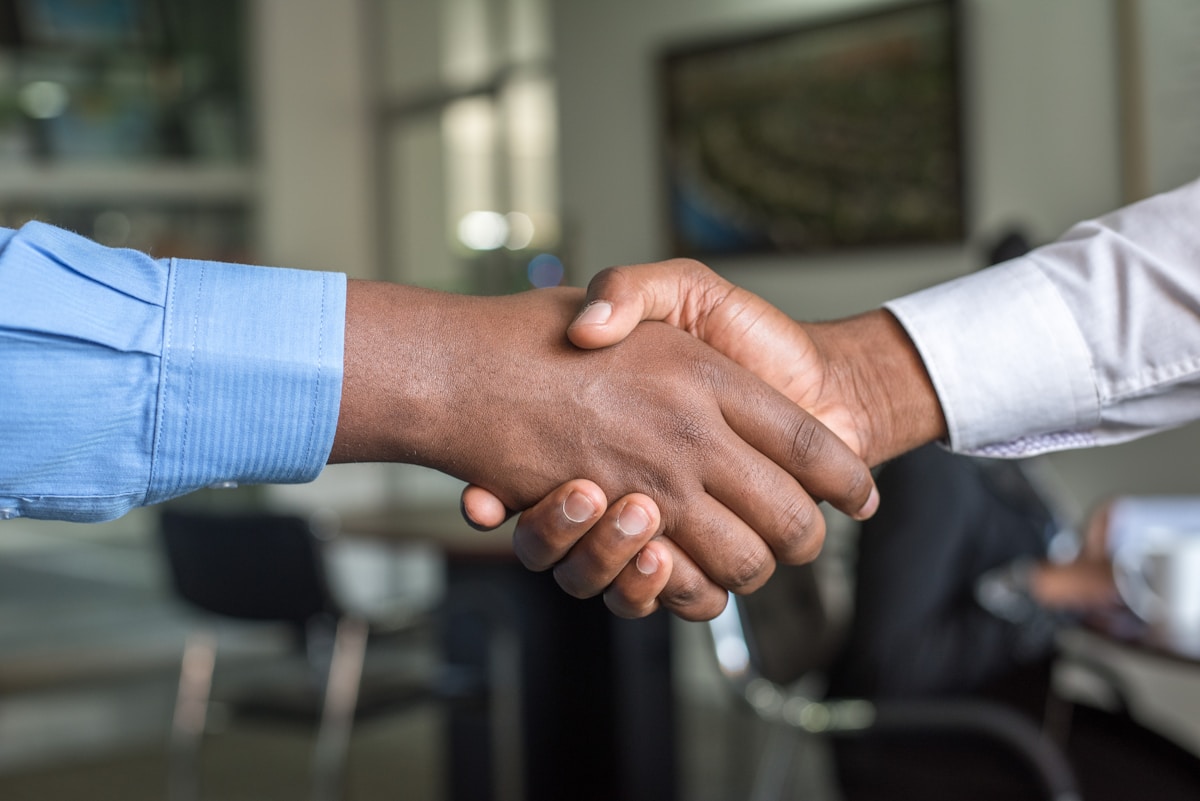 Professional handshake in legal office